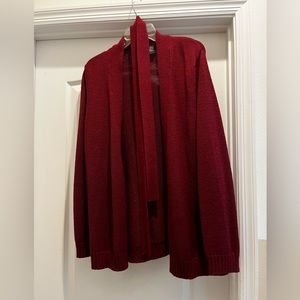 Ladies short maroon, medium cardigan with belt, side belt loops , made of wool .